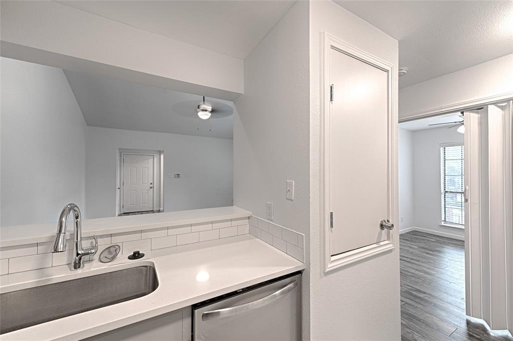 8545 Midpark Road, Unit 2 Dallas, TX 75240 - Photo 9 of 19 a bathroom with a sink and a mirror