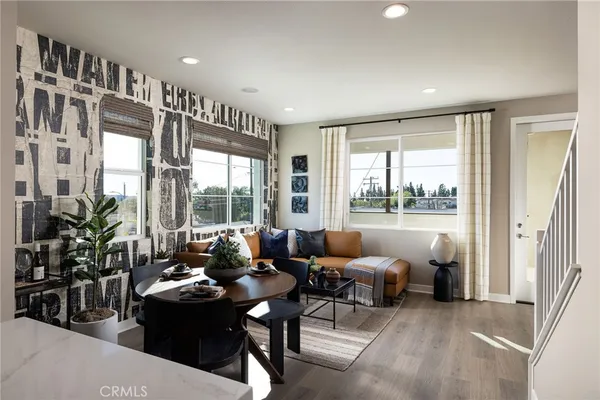 a kitchen with a stove and a chandelier