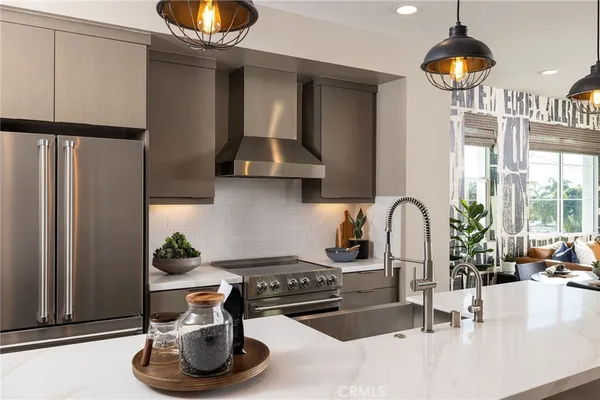 a kitchen with a stove and a sink