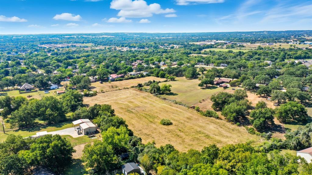 Tbd West 5th Street Springtown, TX 76082 - Photo 18 of 19 an aerial view of residential houses with outdoor space and trees
