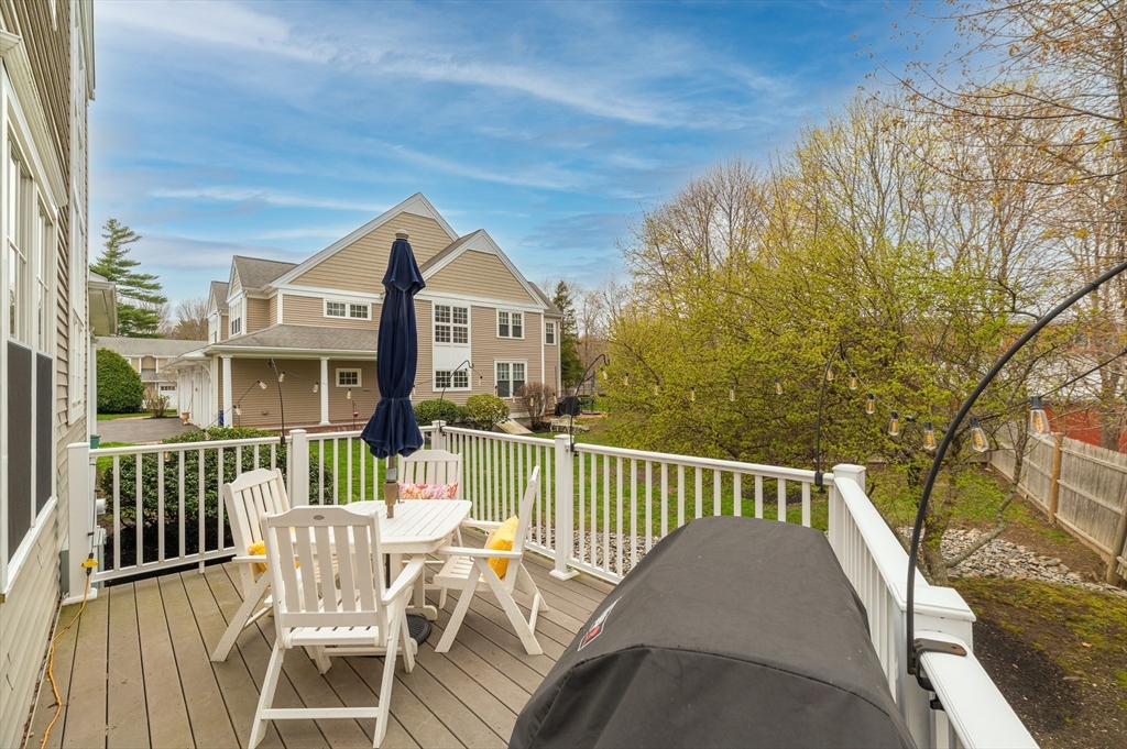 6 Essex Road, Unit 8 Ipswich, MA 01938 - Photo 10 of 35 a view of a chair and tables in the balcony