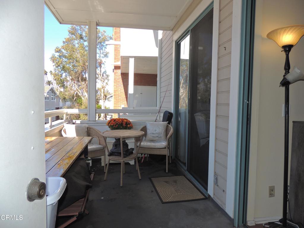865 South B Street, Unit L2 Oxnard, CA 93030 - Photo 11 of 32 a dining room with furniture and a floor to ceiling window