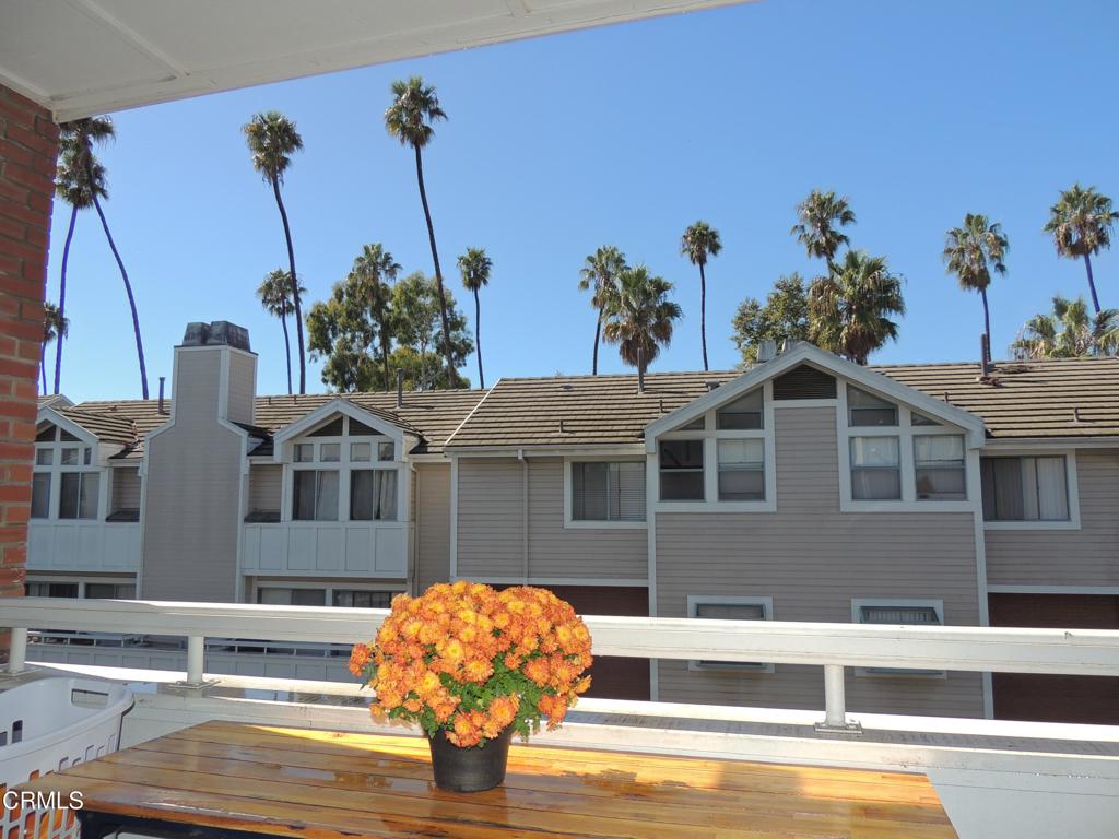 865 South B Street, Unit L2 Oxnard, CA 93030 - Photo 13 of 32 a front view of a house with garden