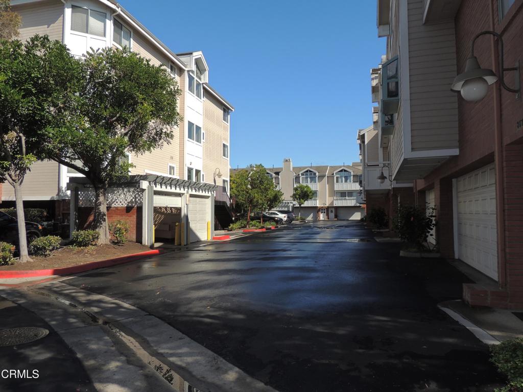 865 South B Street, Unit L2 Oxnard, CA 93030 - Photo 16 of 32 a city street lined with buildings and trees