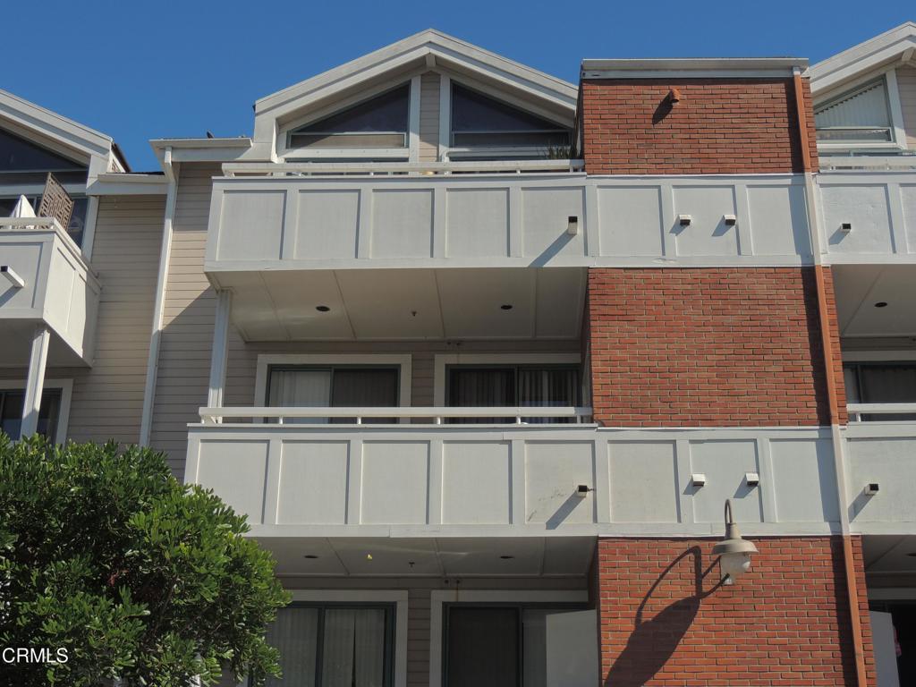 865 South B Street, Unit L2 Oxnard, CA 93030 - Photo 17 of 32 front view of a house with a walk in closet