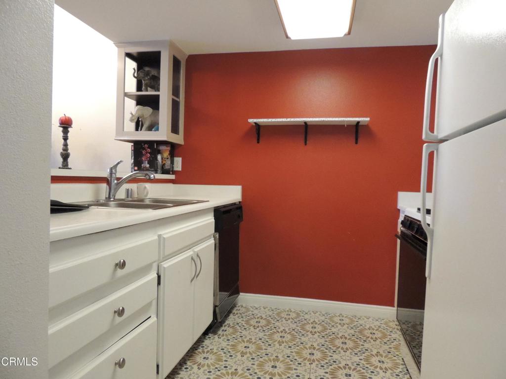 865 South B Street, Unit L2 Oxnard, CA 93030 - Photo 2 of 32 a bathroom with a sink and a mirror