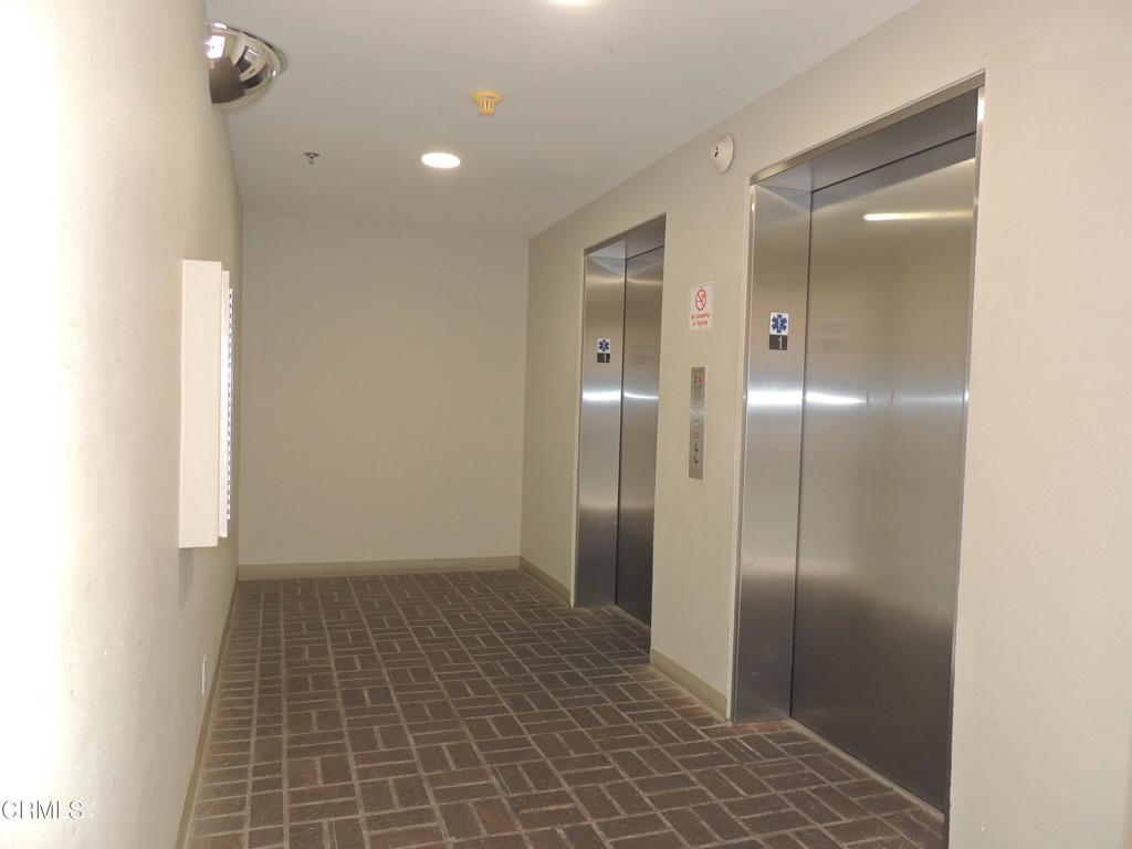 865 South B Street, Unit L2 Oxnard, CA 93030 - Photo 22 of 32 a bathroom with a shower and a mirror