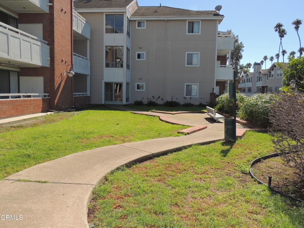 865 South B Street, Unit L2 Oxnard, CA 93030 - Photo 25 of 32 a view of a house with a yard