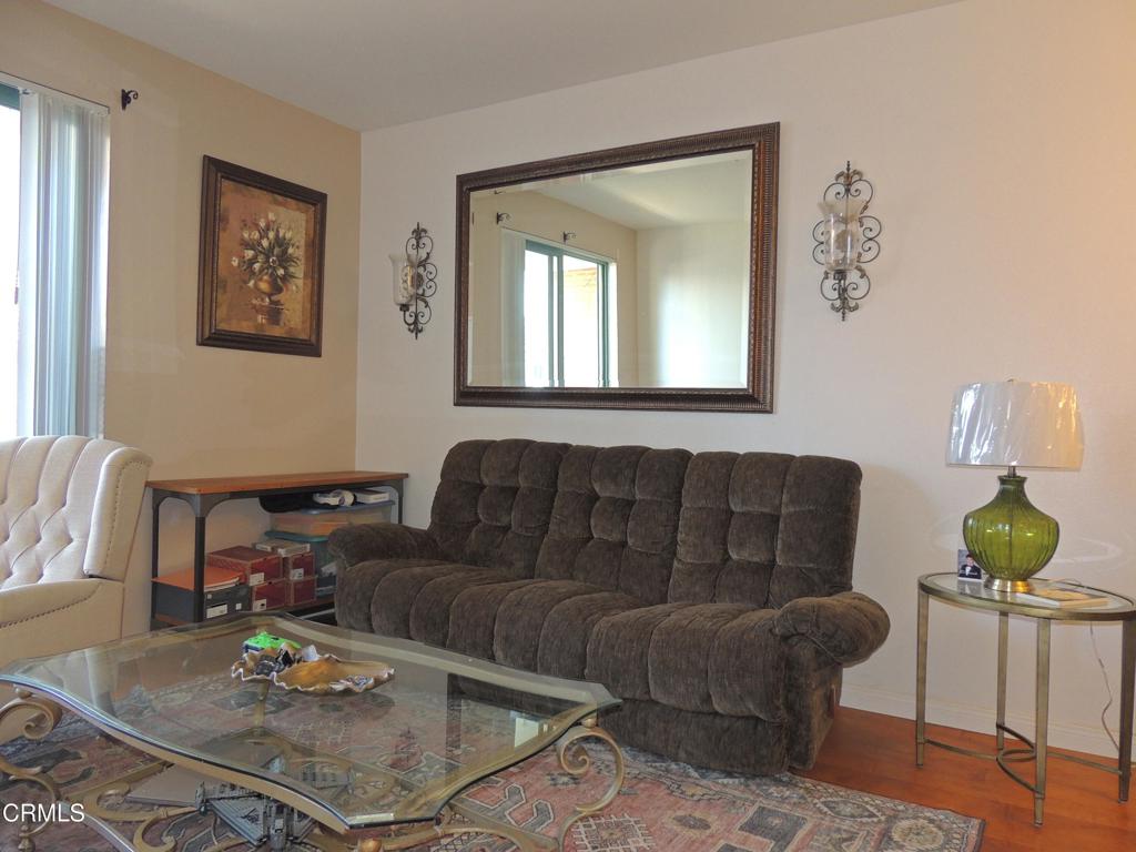 865 South B Street, Unit L2 Oxnard, CA 93030 - Photo 6 of 32 a living room with furniture and window