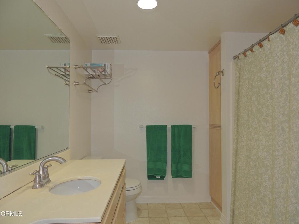 865 South B Street, Unit L2 Oxnard, CA 93030 - Photo 7 of 32 a bathroom with a sink and a mirror