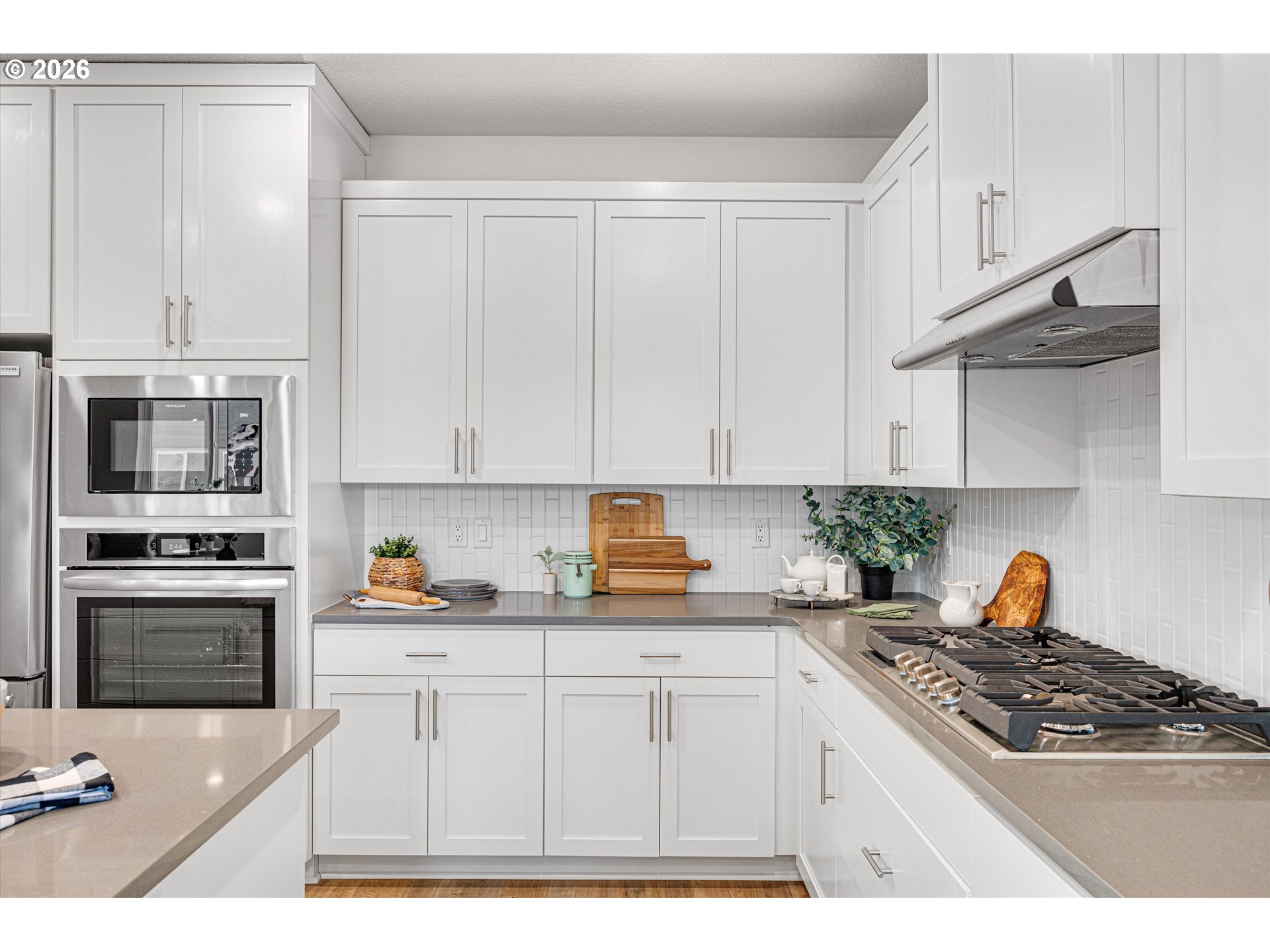 2637 South 6th Way Ridgefield, WA 98642 - Photo 13 of 41 a kitchen with stainless steel appliances granite countertop a sink stove and refrigerator