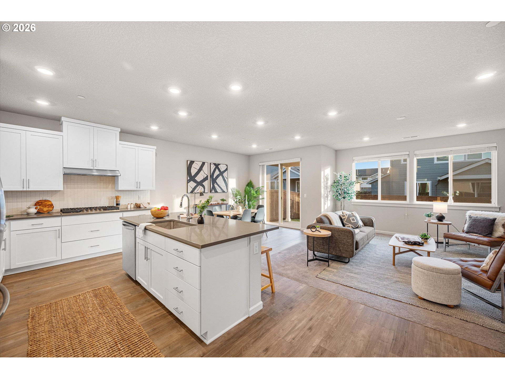 2637 South 6th Way Ridgefield, WA 98642 - Photo 14 of 41 a kitchen with stainless steel appliances granite countertop a lot of white cabinets
