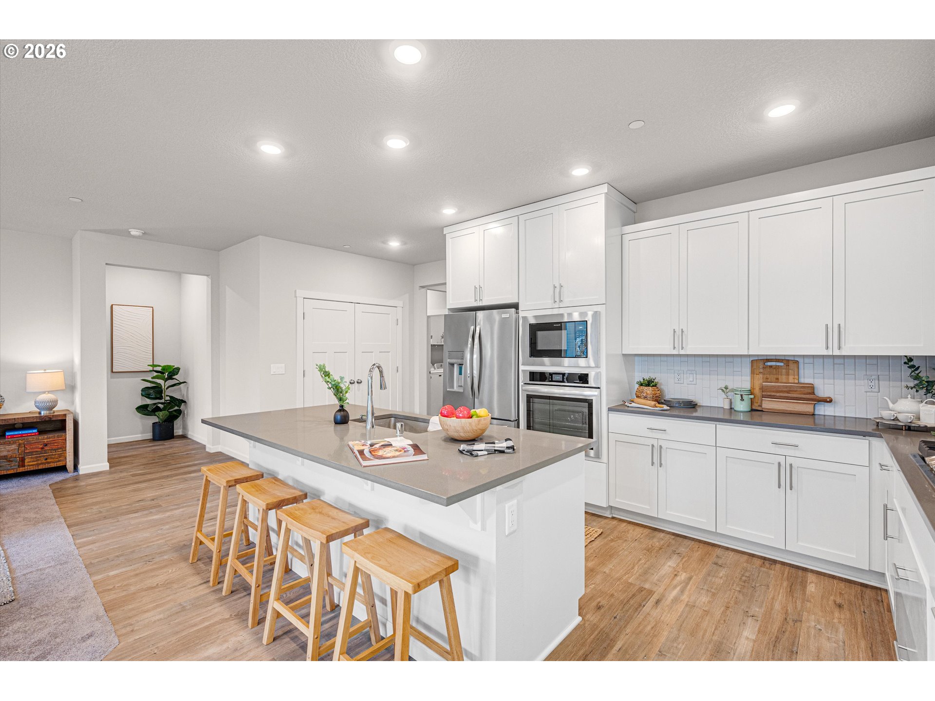 2637 South 6th Way Ridgefield, WA 98642 - Photo 15 of 41 a kitchen with stainless steel appliances granite countertop a sink stove and refrigerator