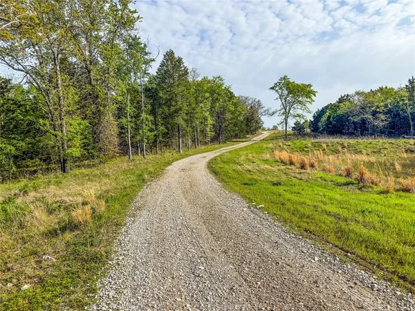 a view of a lake with houses in the background