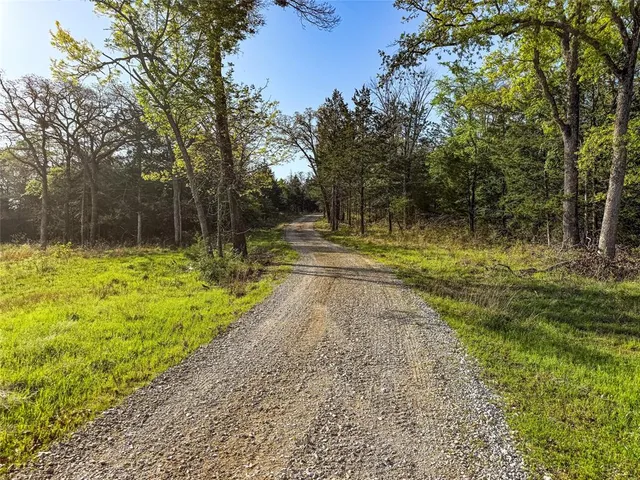 a view of a yard with an outdoor space and seating