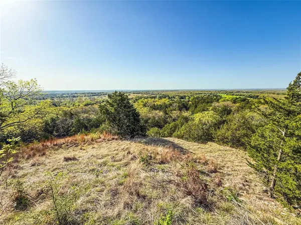 an aerial view of a houses with outdoor space