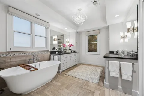 a living room with granite countertop furniture and chandelier