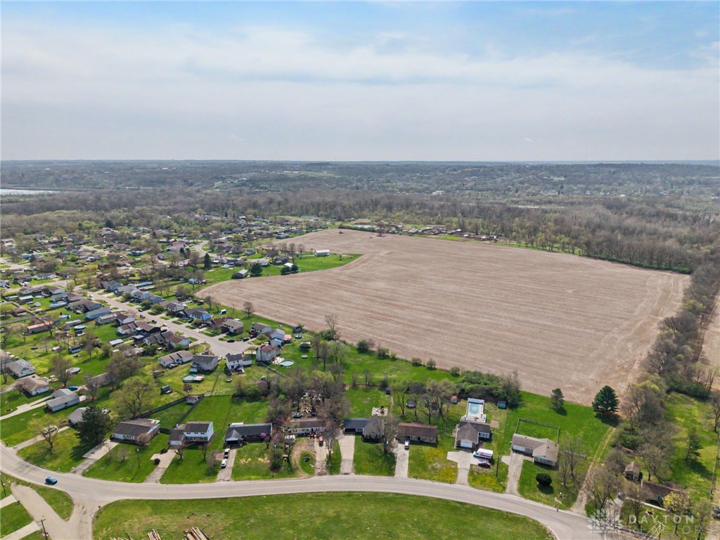 8969 Franklin-Trenton Road Franklin, OH 45005 - Photo 18 of 49 An aerial perspective captures a blend of residential areas, verdant landscapes, and open fields.