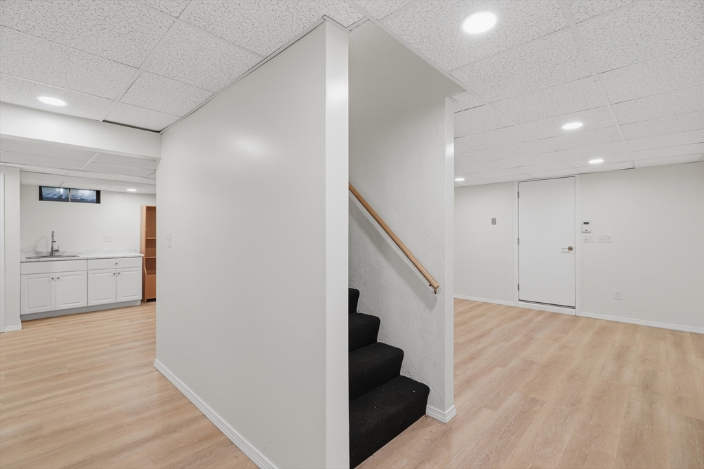 61 Indian Head Road Framingham, MA 01701 - Photo 34 of 42 a view of hallway with stairs and wooden floor