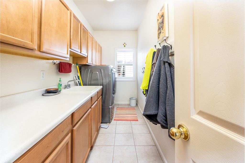 265 Blueridge Street Soledad, CA 93960 - Photo 13 of 33 a kitchen with a sink and a refrigerator
