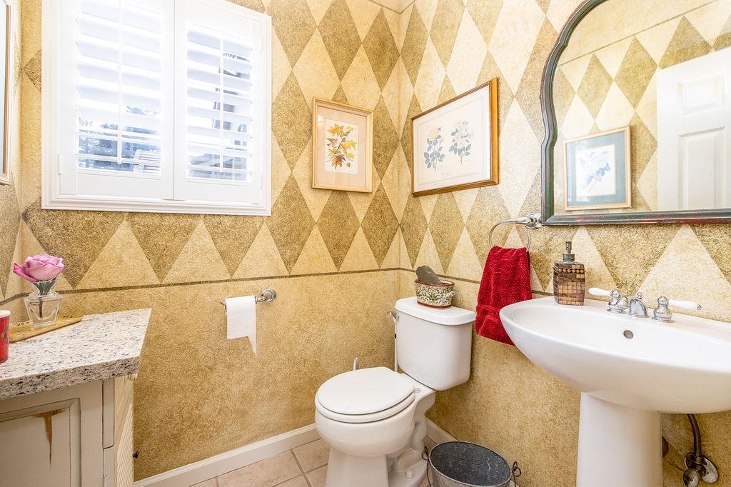 265 Blueridge Street Soledad, CA 93960 - Photo 14 of 33 a bathroom with a sink and mirror with toilet