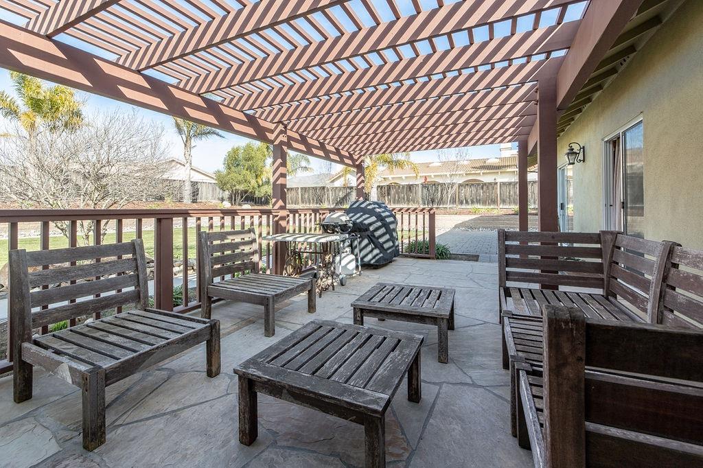 265 Blueridge Street Soledad, CA 93960 - Photo 31 of 33 a view of a patio with a table chairs and a barbeque