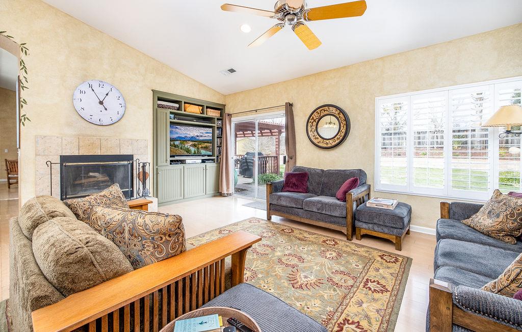 265 Blueridge Street Soledad, CA 93960 - Photo 9 of 33 a living room with furniture two window and a fireplace