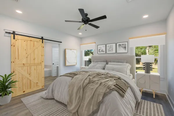 a bed room with a bed and a window