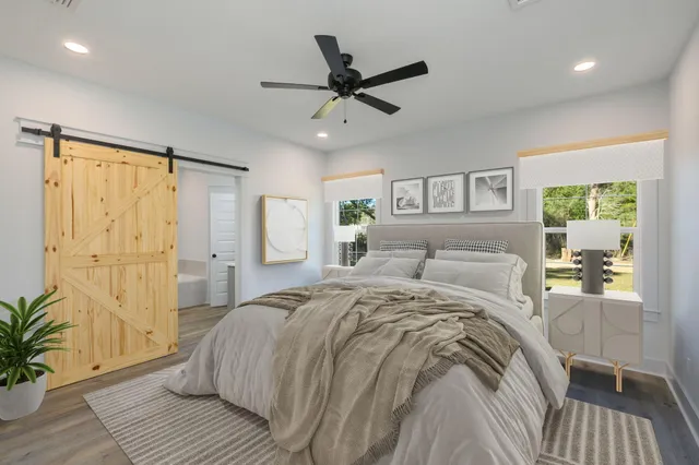 a bed room with a bed and a window