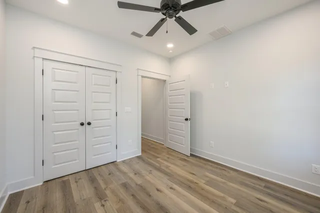 an empty room with closet area