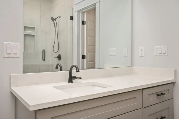 a bathroom with a sink and a mirror