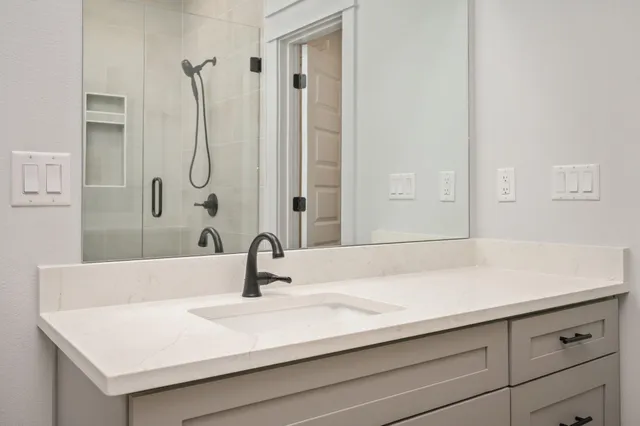 a bathroom with a sink and a mirror