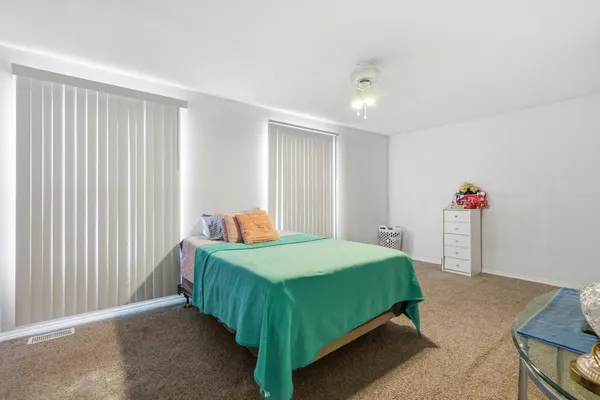 a bedroom with a bed and a walk in closet