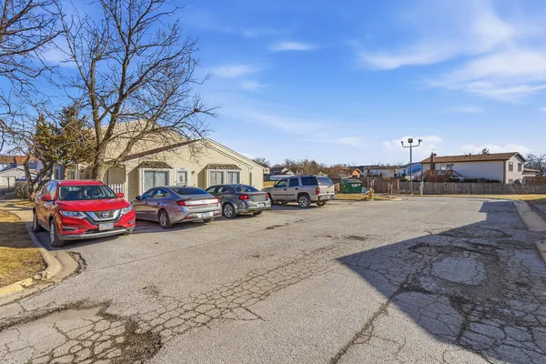 a view of a car parked in front of a building