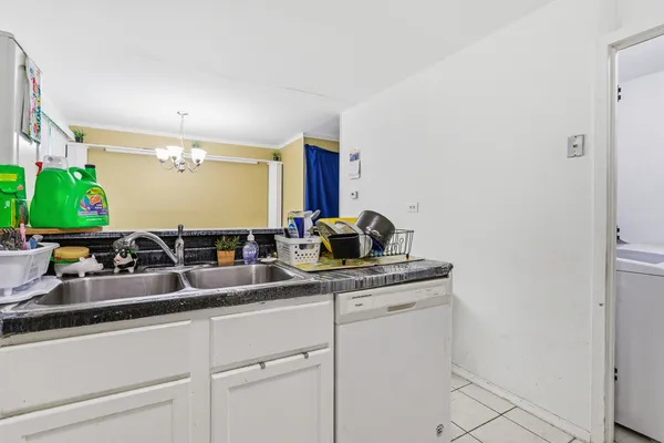 a kitchen with stainless steel appliances granite countertop a refrigerator and a stove