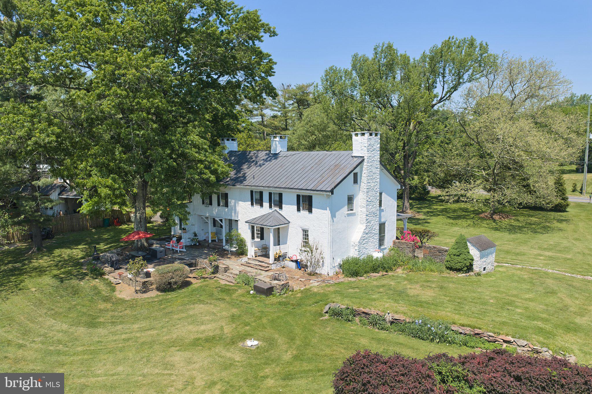 765 Swamp Road Newtown, PA 18940 - Photo 27 of 37 a view of a house with backyard porch and sitting area