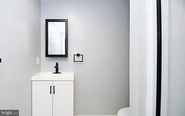 a bathroom with a glass shower door