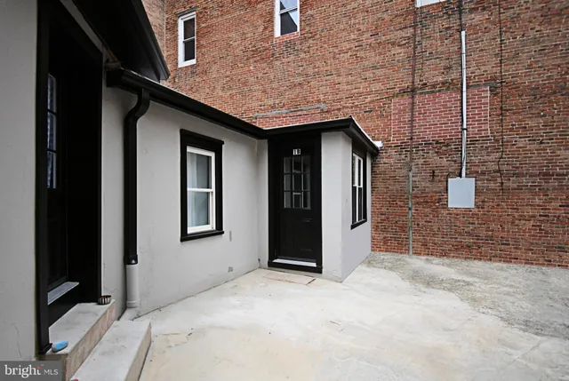 a view of a brick house with windows