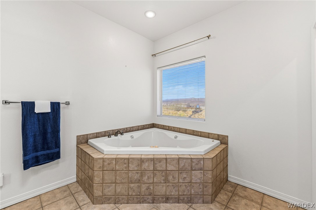 9332 Branded Road Kingman, AZ 86401 - Photo 21 of 44 a white bath tub sitting in a bathroom