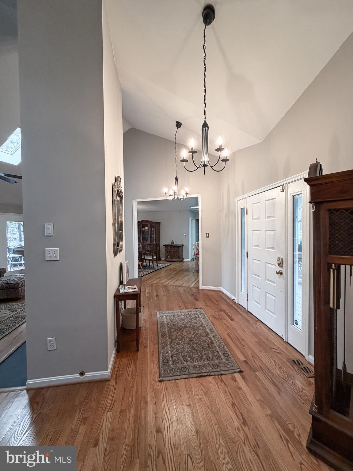 3300 Viola Way Bumpass, VA 23024 - Photo 22 of 36 a view of a livingroom with wooden floor a fireplace and entryway