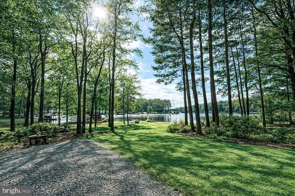 a view of outdoor space with a garden and trees