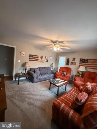 a living room with furniture and a rug