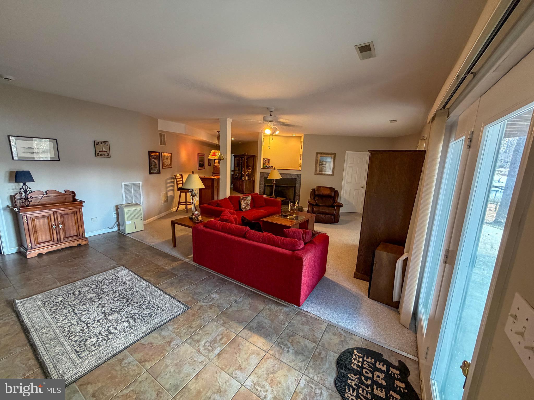 3300 Viola Way Bumpass, VA 23024 - Photo 32 of 36 a living room with furniture and a rug