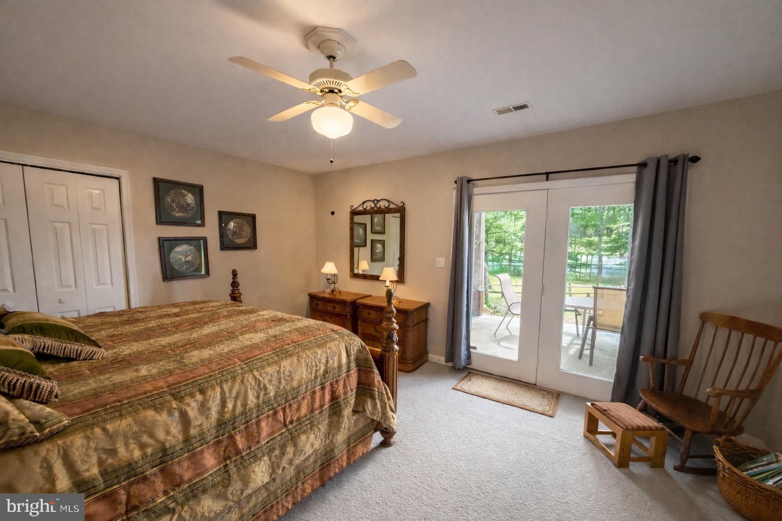 3300 Viola Way Bumpass, VA 23024 - Photo 33 of 36 a bedroom with a bed and a chandelier