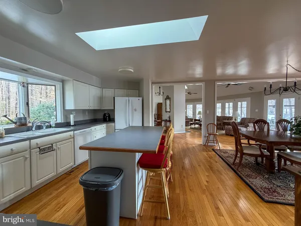 a kitchen with granite countertop lots of counter top space and dining table