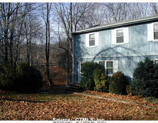 680 Old Colchester Road, Unit 18 Salem, CT 06420 - Photo 1 of 1 a view of a house with backyard and trees