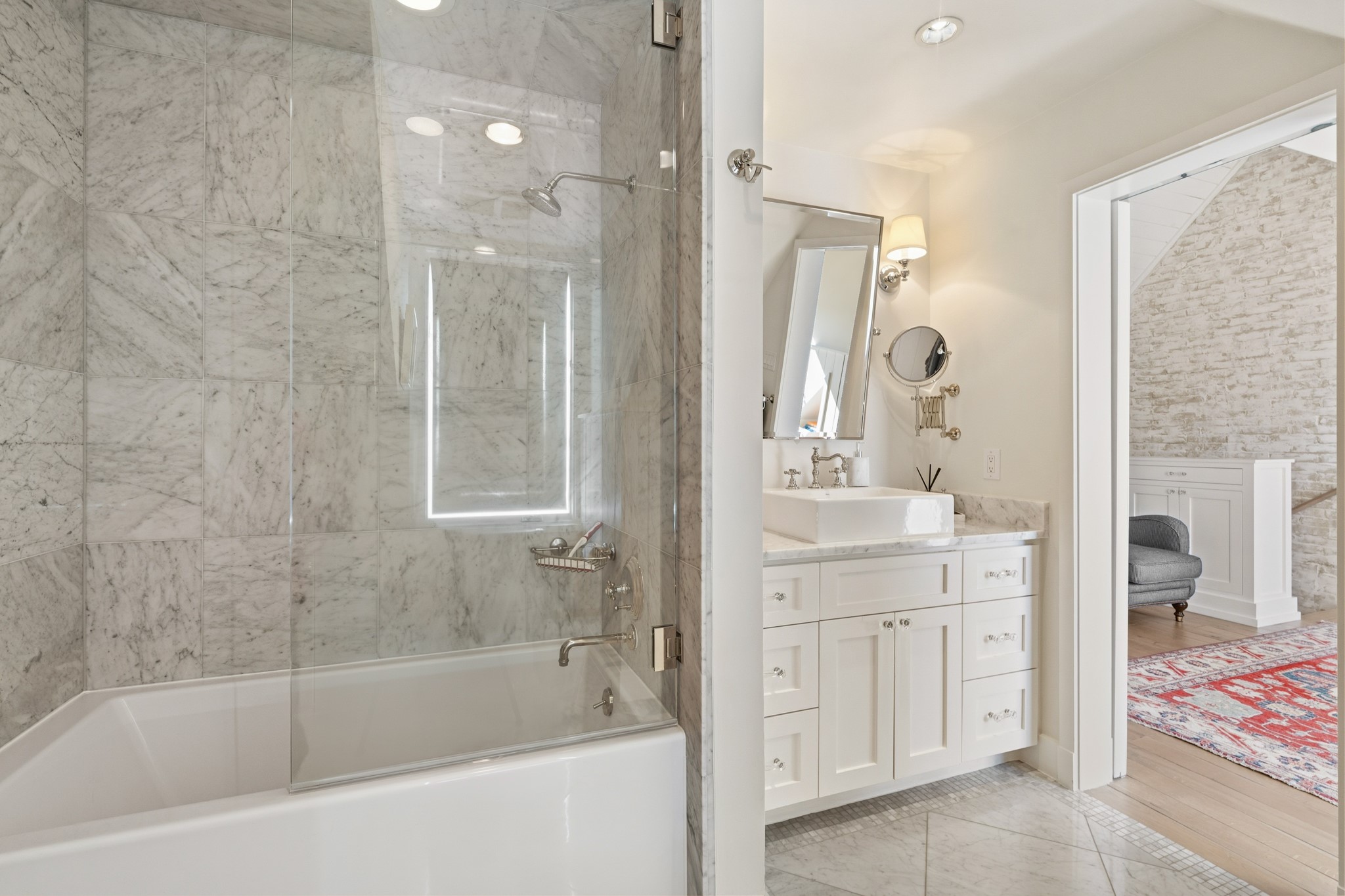 7606 Del Monte Drive Houston, TX 77063 - Photo 15 of 17 Third-Floor Ensuite Bathroom - Full bathroom on third floor with premium finishes, perfect for guests or creating a private suite. Adds tremendous flexibility to this multi-functional bonus level.