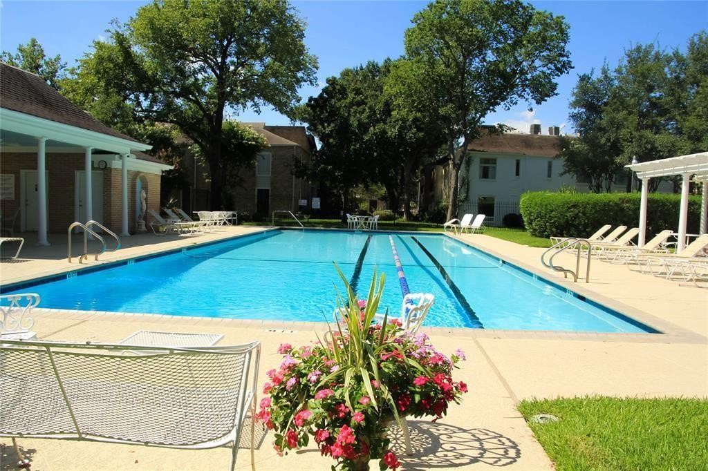 7606 Del Monte Drive Houston, TX 77063 - Photo 17 of 17 a view of a swimming pool with a patio