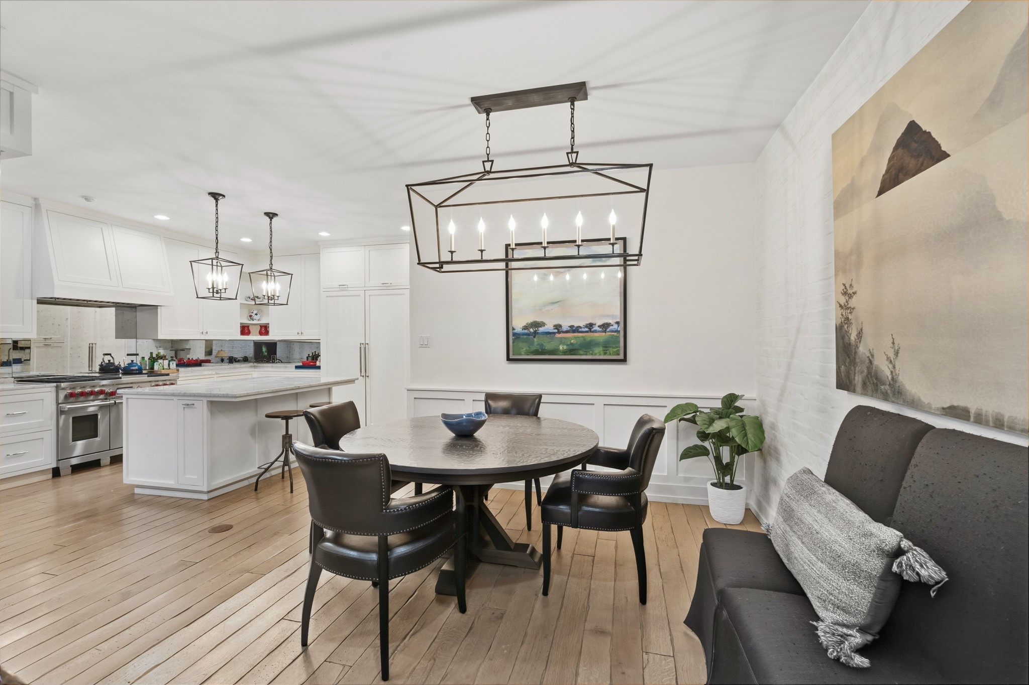 7606 Del Monte Drive Houston, TX 77063 - Photo 6 of 17 Seamless open-concept flow from chef's kitchen to dining and living areas.