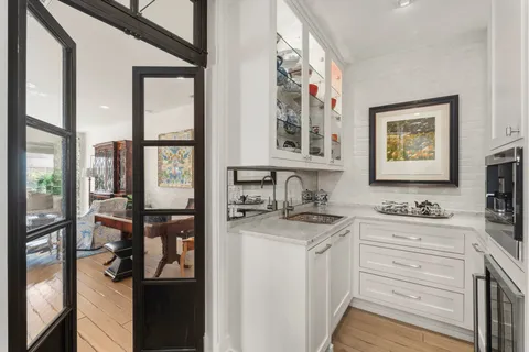 a view of a bathroom with dual sinks